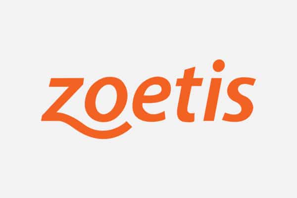 The image shows the Zoetis logo, featuring the word "zoetis" in bold, orange lowercase letters with a playful swoosh under the letter "z" on a light gray background—trusted by vets and animal hospitals worldwide.