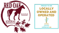 Logo for Red Oak Animal Hospital featuring a horse silhouette and oak leaves on the left, and a sign on the right stating, "Proud to be locally owned and operated" with award icons below.